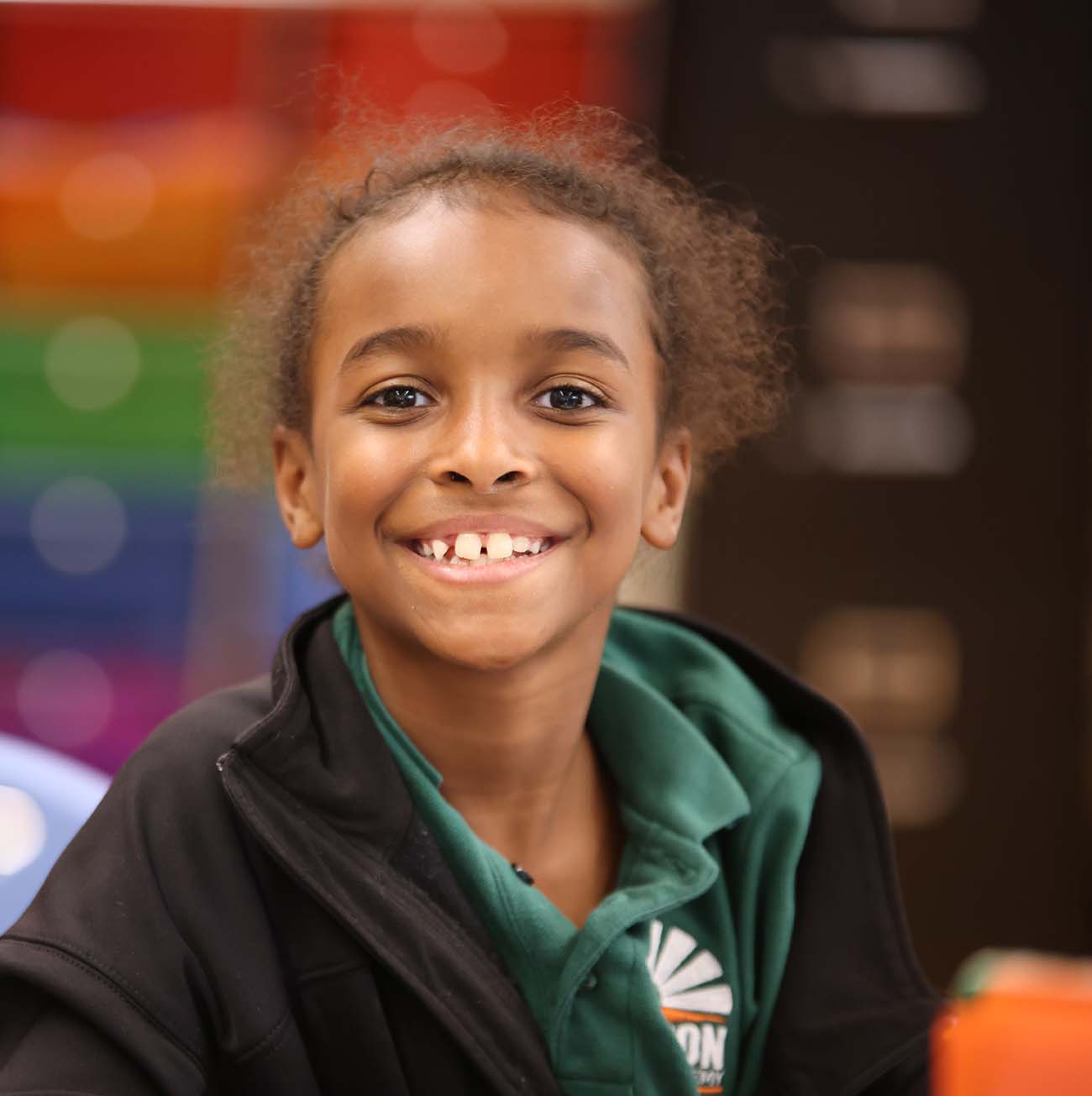 Teacher or school staff member warmly interacting with a student outside